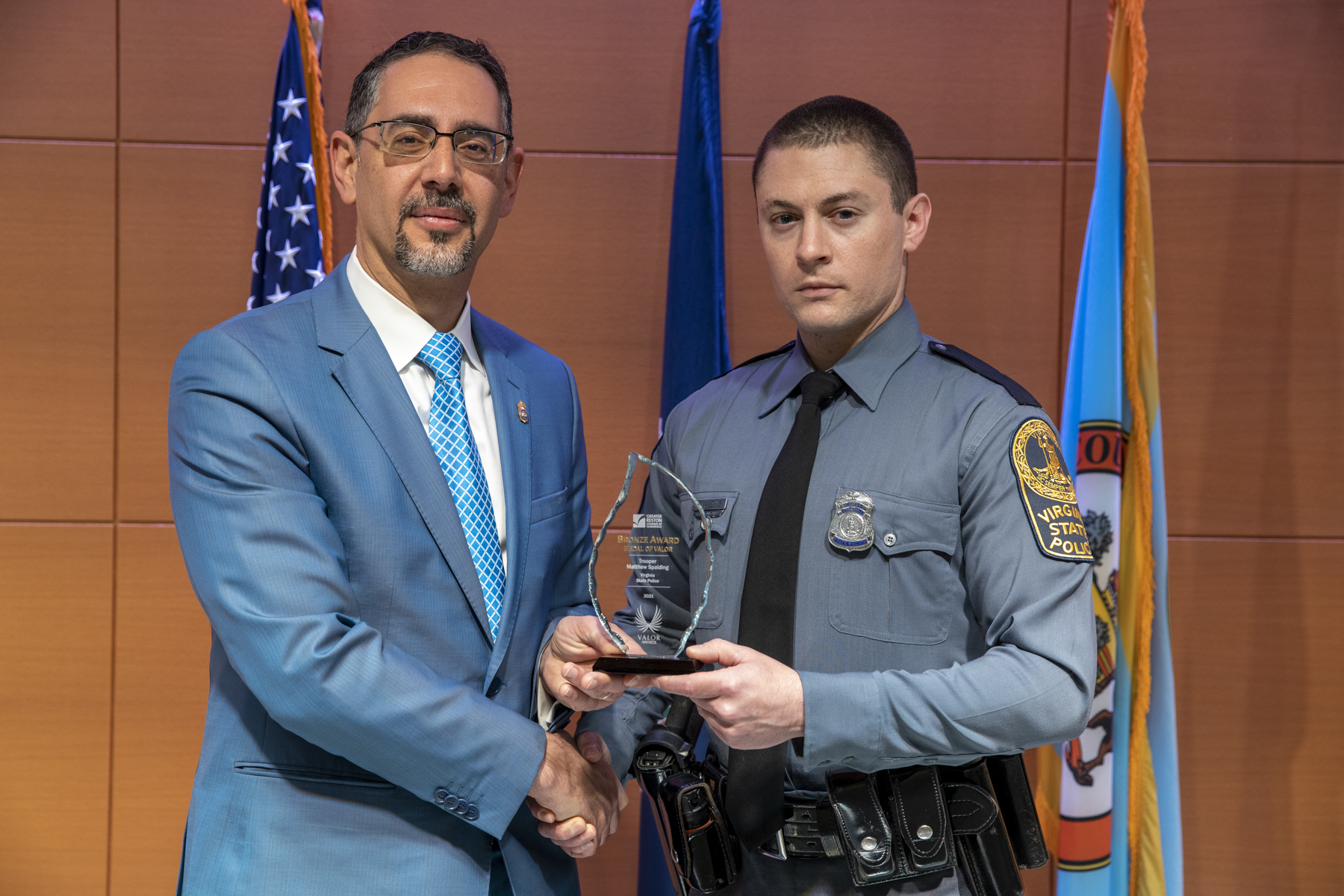 Joey Musmar, presents the Bronze Medal of Valor to Fairfax County Police Department and Virginia State Police.